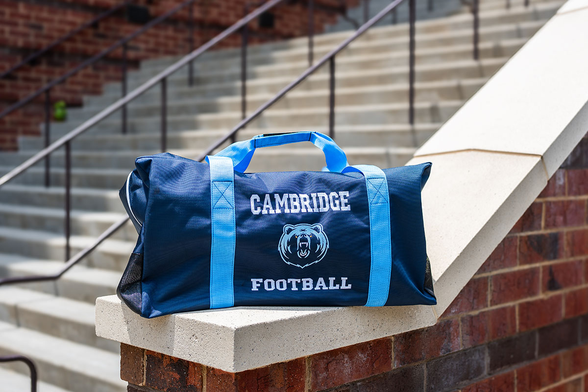 Cambridge Football players with the new team travel bags
