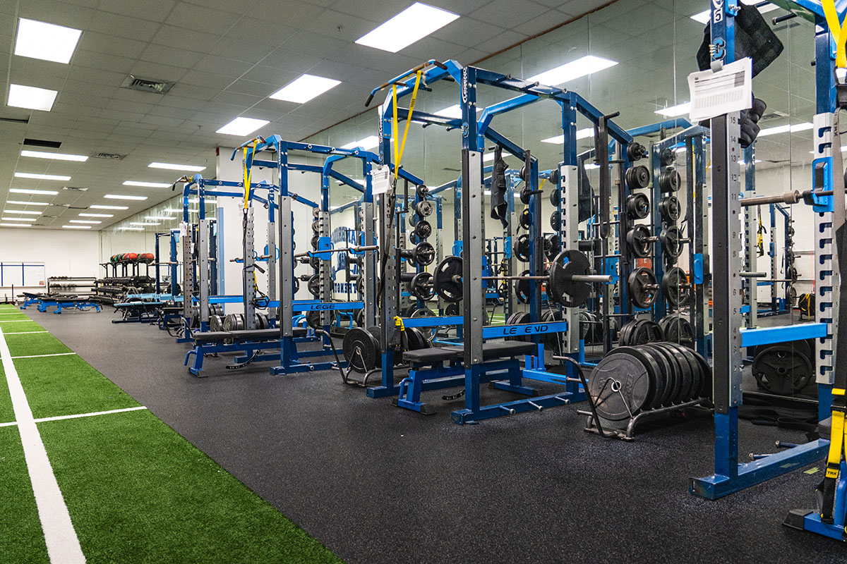 Cambridge football athlete lifting on a new Titan bench