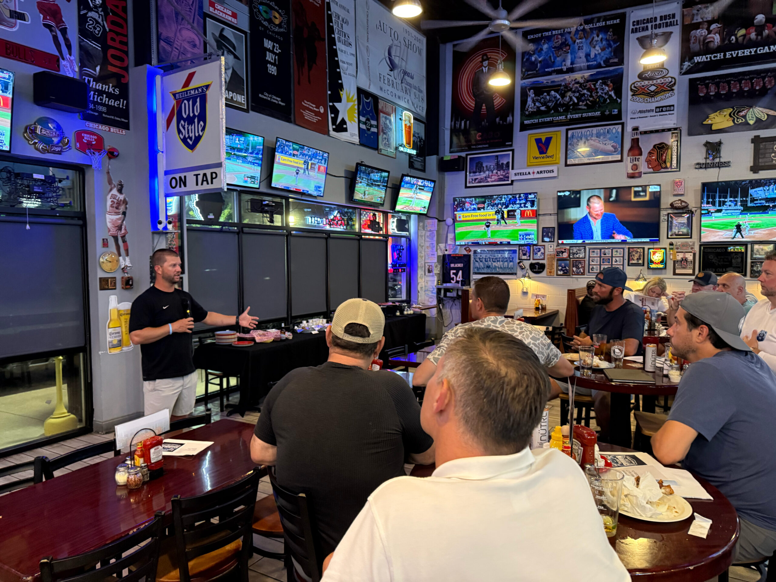 Coach Jones addressing Bear Gridiron Club members at Bobby G's