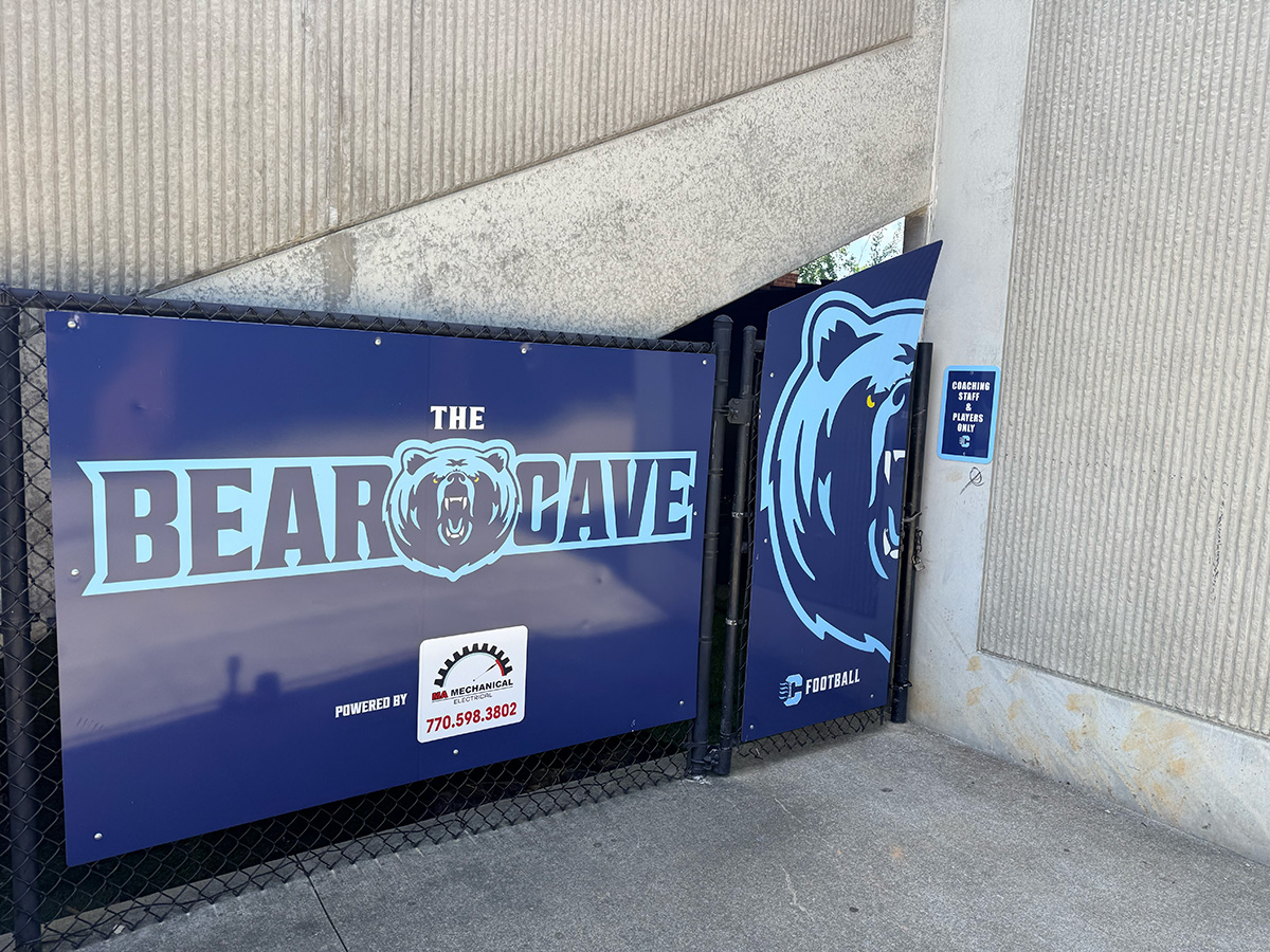 The Bear Cave entrance gate with Cambridge Bears signage